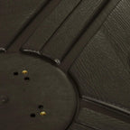 Close-up of coffee-brown molded parasol base ribs and circular filling opening