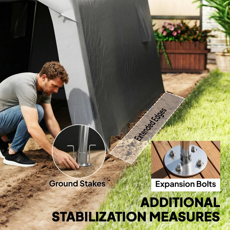 Grey storage shed tent staked to the ground using expansion bolts and stakes
