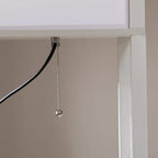 White floor lamp shelving unit with hanging chain pull and lit panel