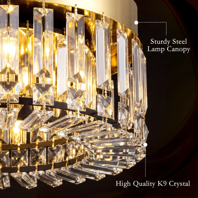 Gold-tone crystal chandelier close-up with clear prisms and metallic lamp canopy