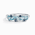 Sterling silver half-eternity band ring with blue pear-cut gemstones, oval profile