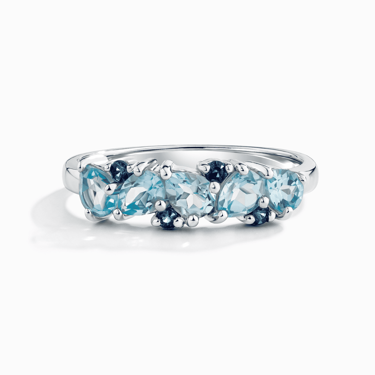 Sterling silver half-eternity band ring with blue pear-cut gemstones, oval profile