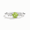 Sterling silver five-stone ring with green round center and four clear stones