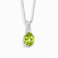 Sterling silver pendant necklace with green oval gemstone and small clear stones