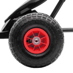 Inflatable go-kart tire with black tread and red wheel rim, close-up