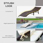 Curved-back cream-cushioned rattan sun lounger chair with dark frame