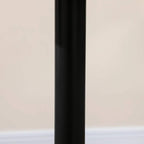 Matte black table leg, cylindrical shape, extending from tabletop to round base