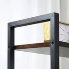 Close-up of black metal frame and dark brown shelf board with mounting holes