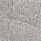 Light grey textured Berber-fleece upholstery fabric close-up with tufted square pattern