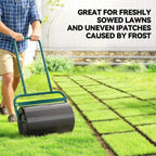 Black drum lawn roller with dark green handle for leveling freshly seeded grass
