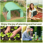 Green walk-in greenhouse tent with zipped front opening in a garden yard