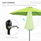 Light green garden parasol umbrella with manual crank opening mechanism on the pole