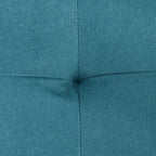Close-up of blue upholstered sofa bed fabric with stitched seams