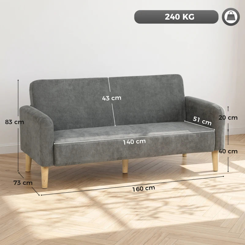 Grey upholstered sofa with wide seat, padded arms, and tapered light wood legs