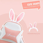 Pink and white gaming chair close-up with detachable bunny-ear headrest and padded backrest