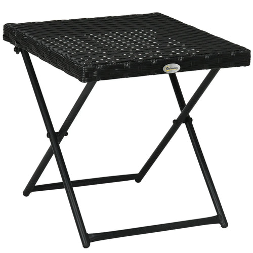 Black square wicker rattan folding table with woven top and crossed metal legs