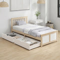 Pine storage bed with headboard and open pull-out drawers for clothing storage