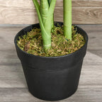 Close-up of artificial monstera base in black pot with faux moss