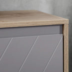 Grey door panel with diagonal decorative lines on oak cabinet frame, flat tabletop