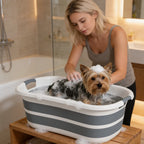 Dog bath tub in use with a small dog being washed in soapy water