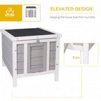Grey wooden outdoor hutch with elevated legs and open front door