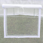 White greenhouse cover mesh close-up with tied roll-up window section