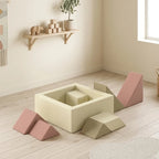 Beige foam climbing blocks with pink ramp piece and square ball-cube