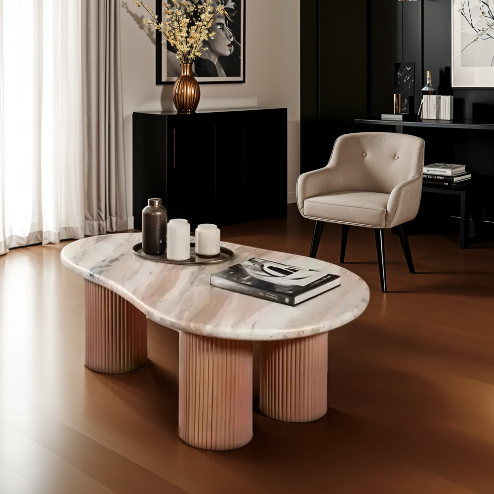 Modern living room with a marble coffee table and decorative items.