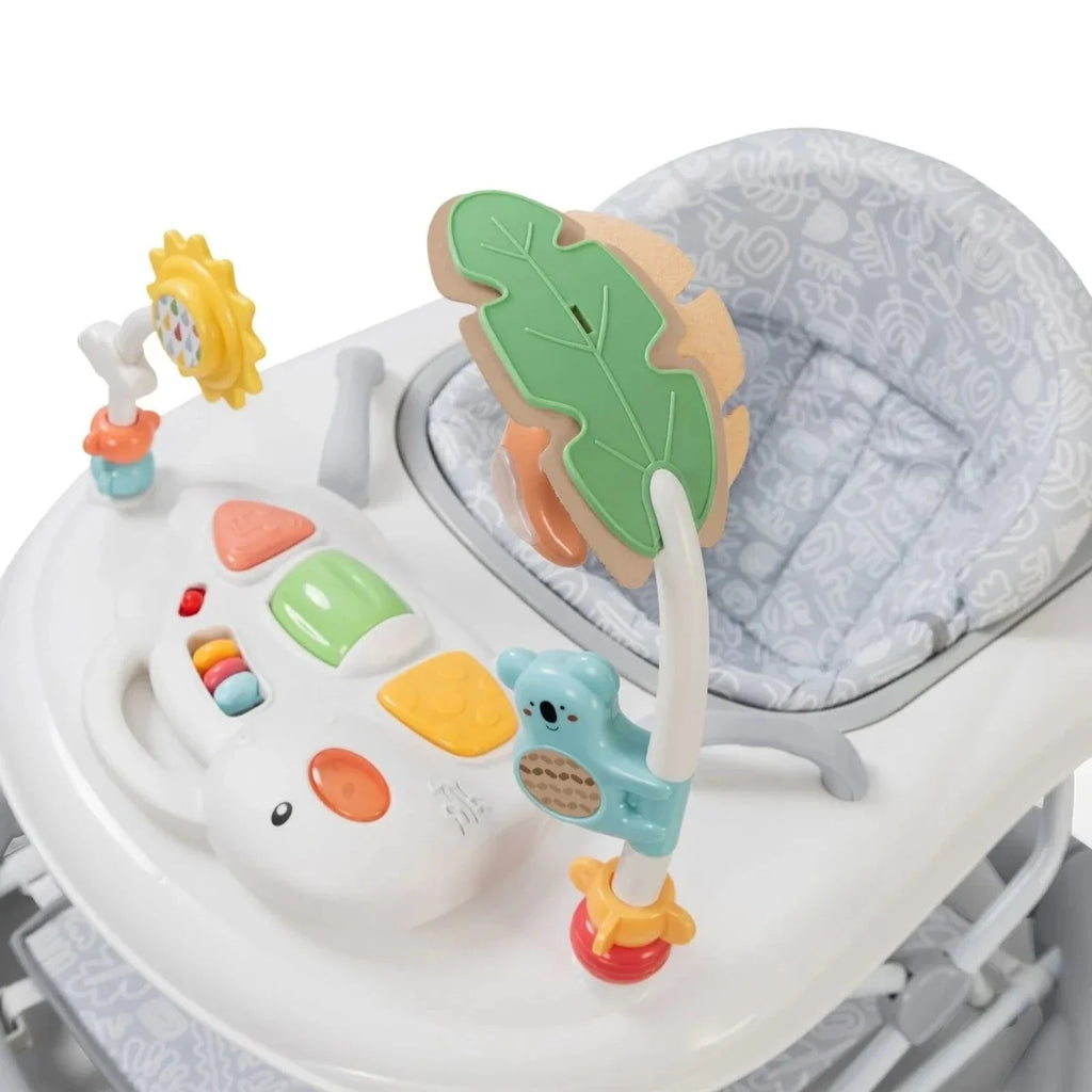 Infant walker close-up of front activity panel with colorful blocks and leaf toy