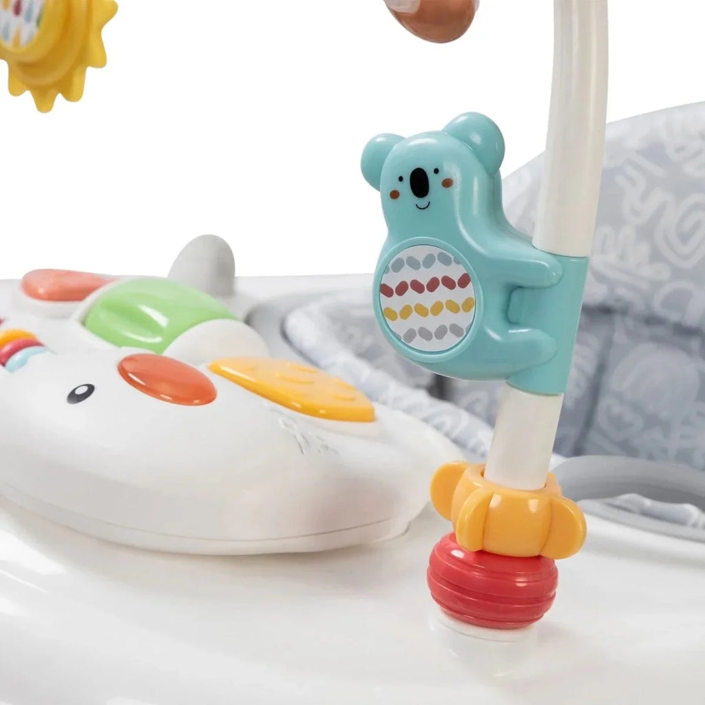Infant walker close-up of blue animal toy and colorful activity tray controls