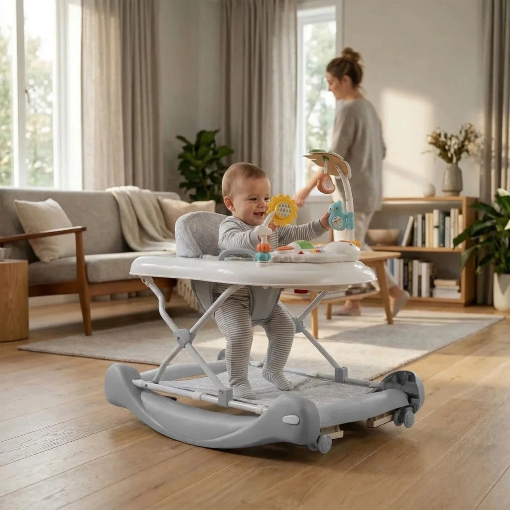 Baby using gray activity walker with toy arch and hanging toys, aqua details