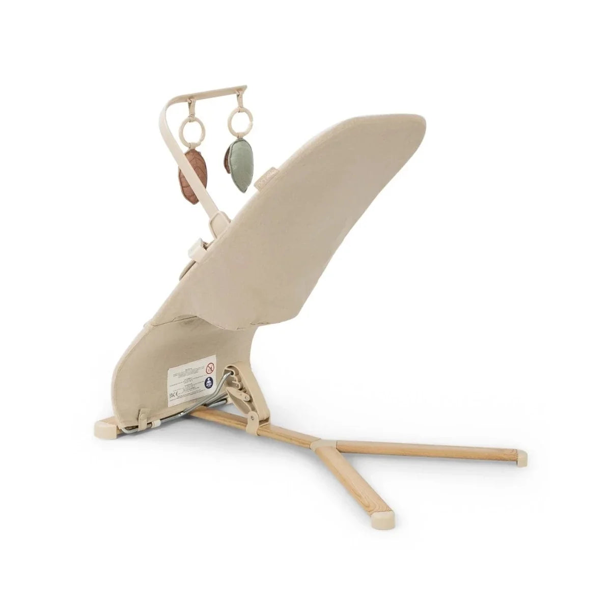 Oatmeal baby bouncer angled side view with hanging leaf toys and reclining wooden frame