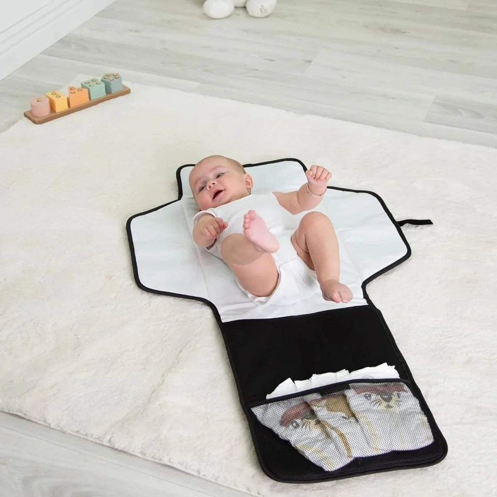 Red Kite travel changing mat open flat, white top and dark base with wipe pocket