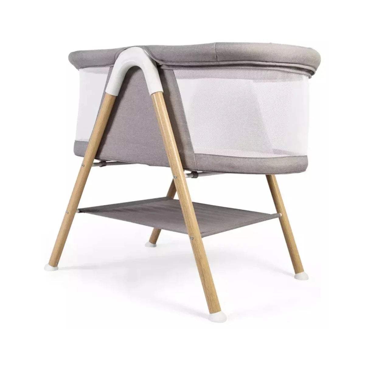 Grey snooze crib with curved handle, white sides, wooden legs, open lower shelf.