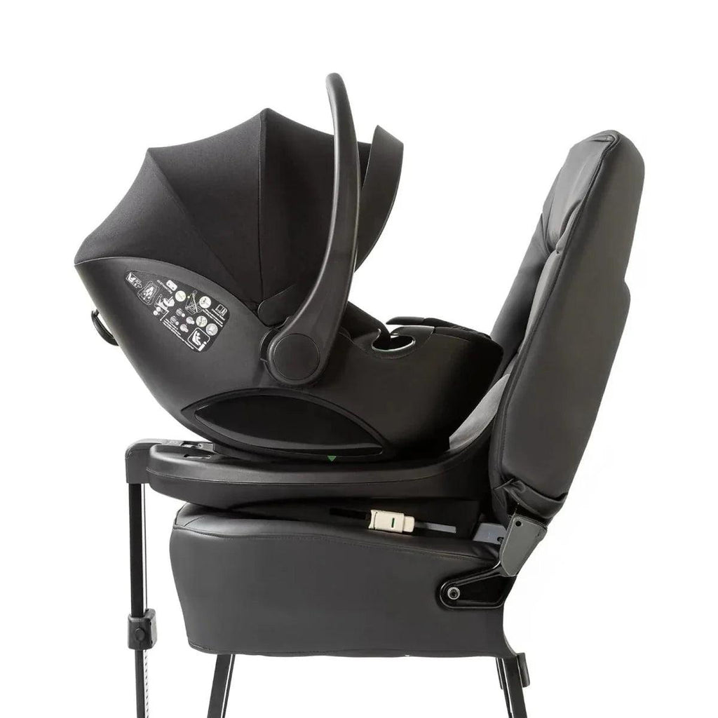 Black ISOFIX child seat base with attached seat and armrest belt guide