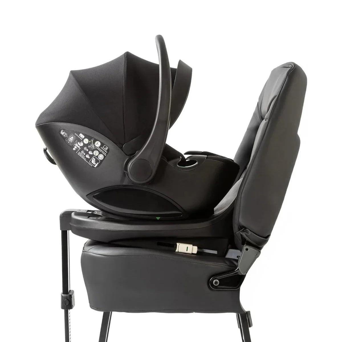 Black ISOFIX child seat base with attached seat and armrest belt guide