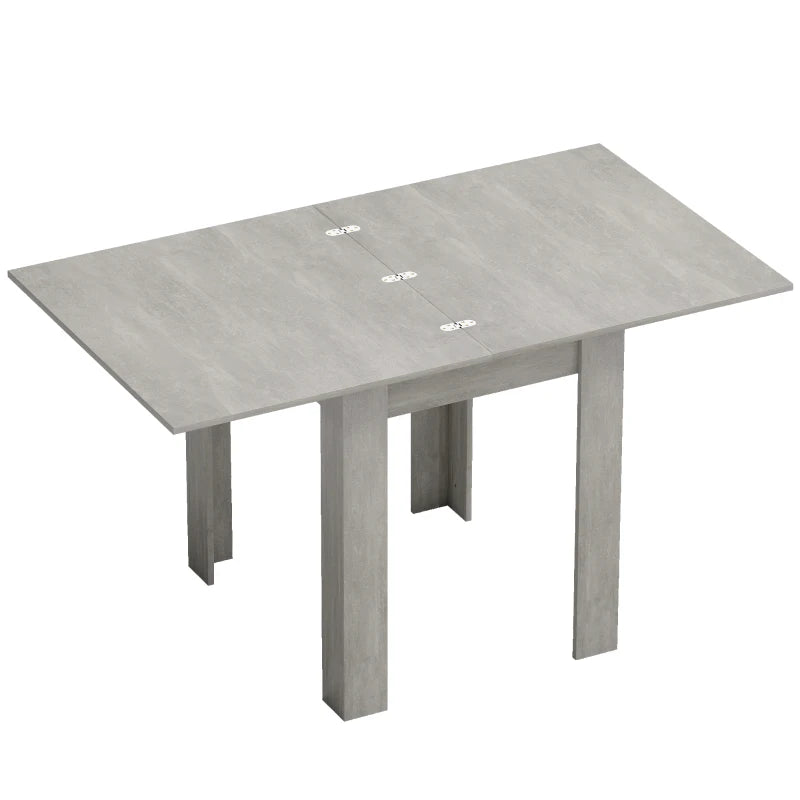 Grey rectangular dining table with drop-leaf design and four sturdy legs.