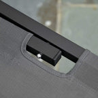 Grey mesh carry handle on black frame of recliner sun lounger