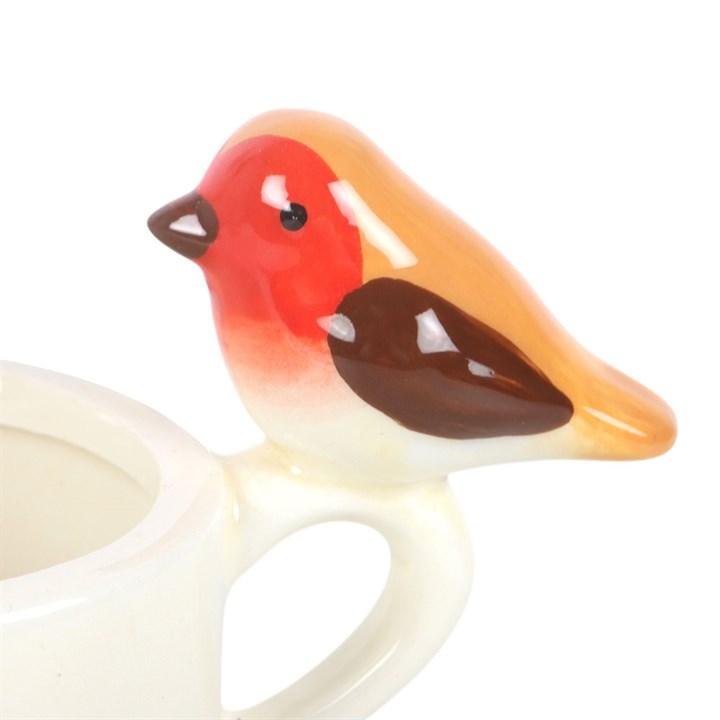 Ceramic robin tealight holder, red-orange bird perched on white cup handle
