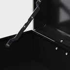 Open black tool chest interior with lid support arms and fasteners