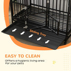 Black dog crate with sliding removable tray inside for easy cleaning