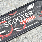 Black scooter deck with printed street design and textured anti-slip surface