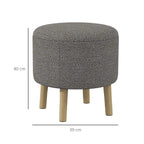 Light grey round storage ottoman with tufted top and wooden legs