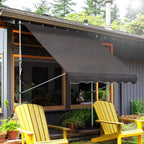 Grey retractable patio awning extended over an outdoor seating area