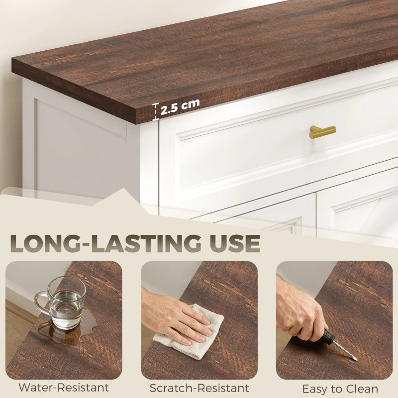 Brown tabletop edge on a white sideboard with a gold drawer pull.