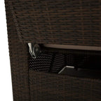 Brown woven rattan sofa frame close-up with underside storage latch detail