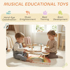 Children playing a wooden musical table with three drums, cymbals, and xylophone keys