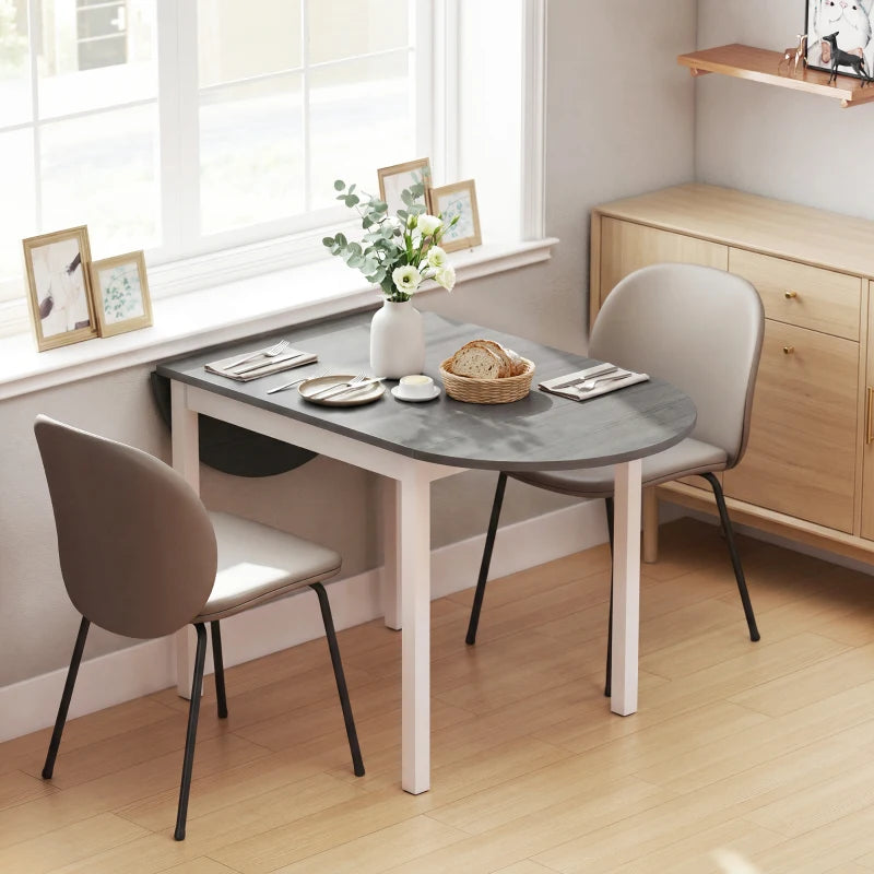 Grey drop-leaf dining table with white legs, partially opened oval tabletop