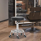 Black round padded stool seat on chrome pedestal with swivel base and caster wheels