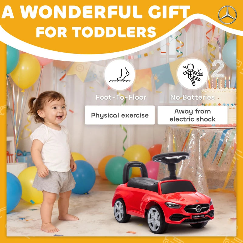 Red Mercedes-Benz ride-on car with child standing by, black seat and pedals